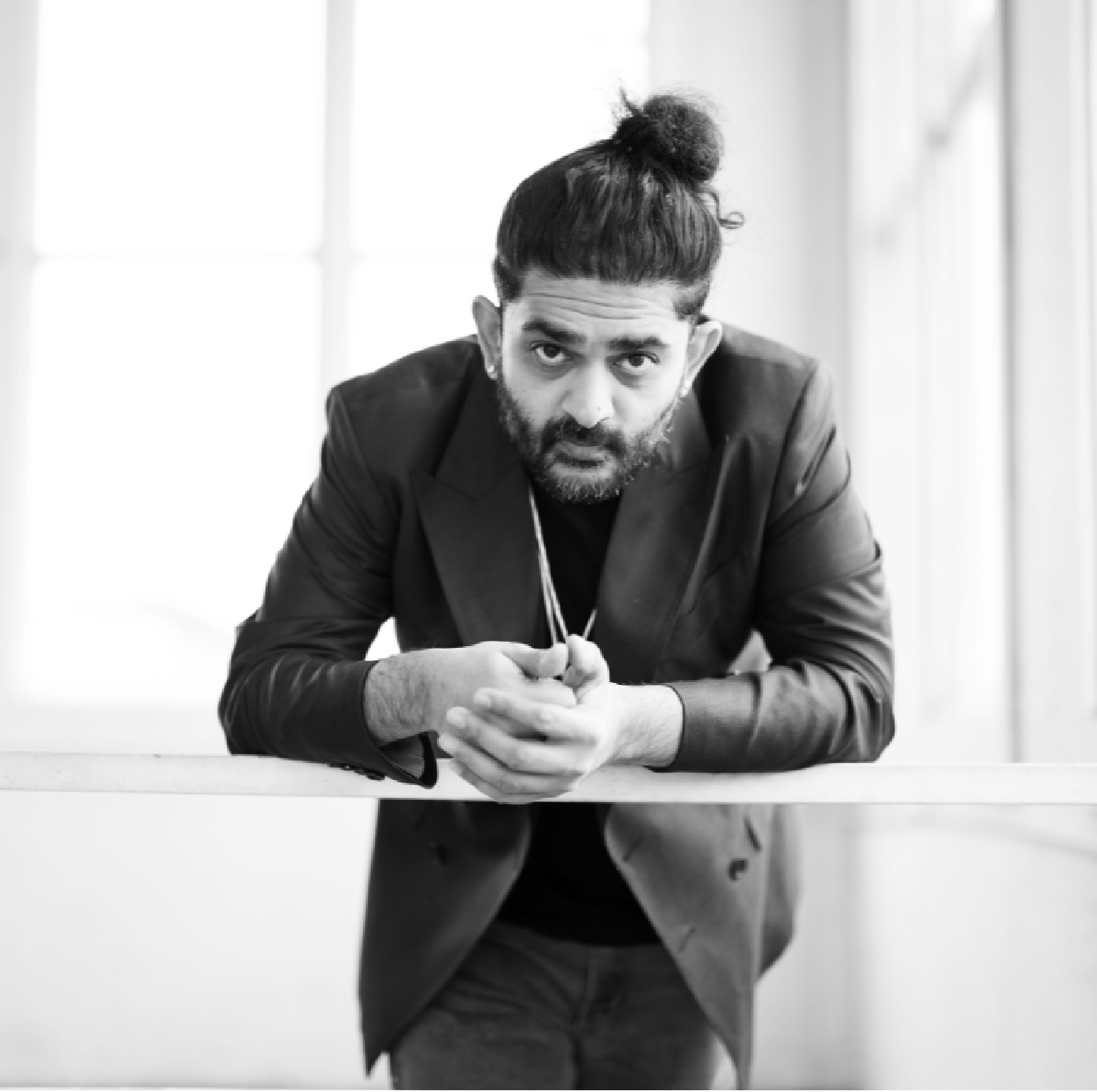 Sid Sriram performing live, blending Carnatic music with Western soul and pop influences.